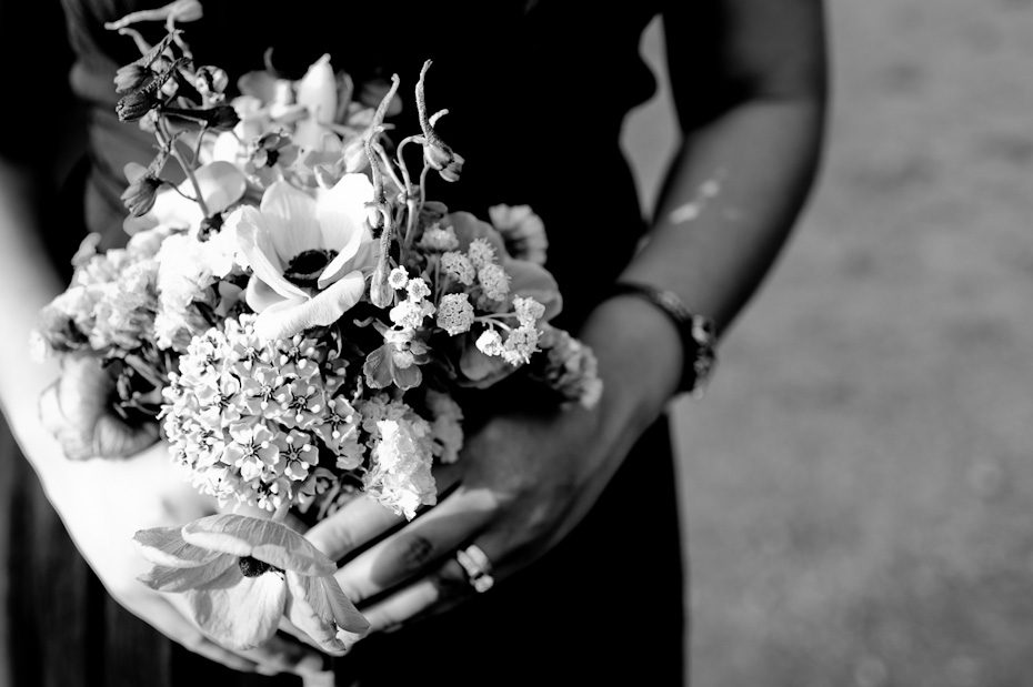 black_and_white_wedding_photo_bridesmaid_holding_wildflower_bouquet