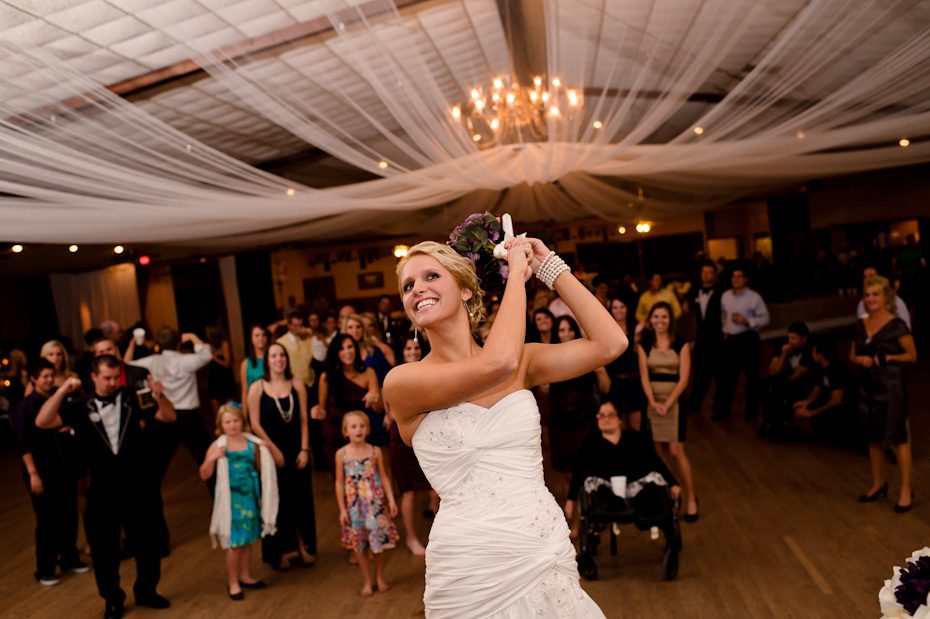 Bride Tossing bouquet to bridesmaids