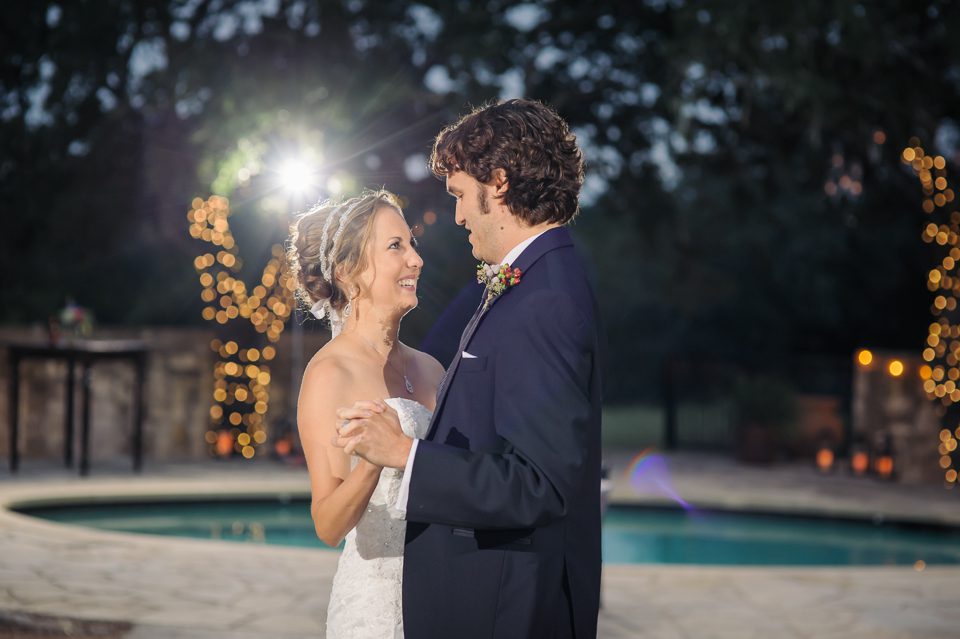 couple dancing twinkle lights in trees