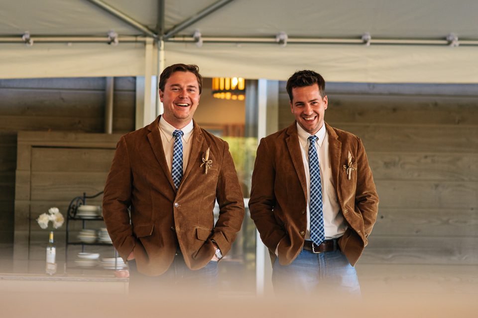 groomsmen wearing brown corduroy jackets blue jeans
